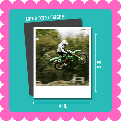 Vintage Retro Polaroid-style custom photo magnet, flexible 2mm thick personalized fridge magnet with uploaded photo. Large retro magnet with a photo of a person on a green motorcycle, surrounded by a pink border and teal background.