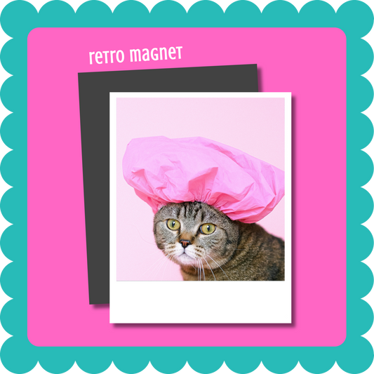 Vintage Retro Polaroid-style custom photo magnet, flexible 2mm thick personalized fridge magnet with uploaded photo. Cat wearing a pink shower cap on a retro magnet with a pink border. Cat Magnet