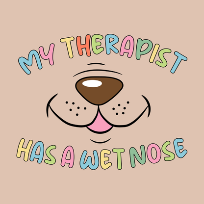 Dog or cat themed humorous novelty, funny fridge magnet. Cartoon dog face with text 'My therapist has a wet nose' on a beige background